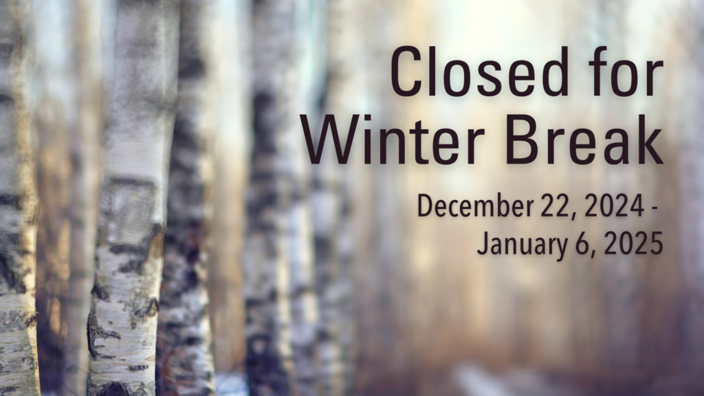 Blurred image of birch trees with text announcing that we are closed for winter break from December 22, 2024, to January 6, 2025.