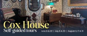 Interior view of Cox House featuring Victorian-style furnishings with carved wooden armchair, floral wallpaper, writing desk with lamp, and vintage portraits, promoting self-guided tours on select dates.