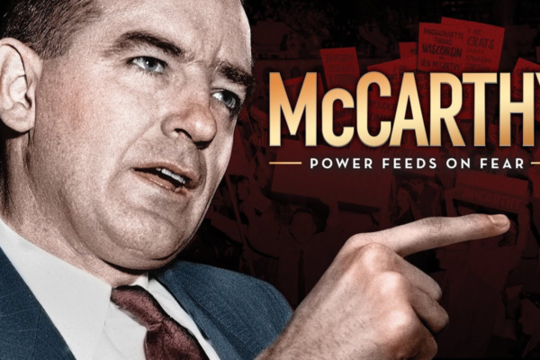 A man is depicted pointing with his right hand, wearing a suit and tie, set against a background of protest signs. The text reads "McCARTHY Power Feeds on Fear" prominently on the right side of the image.