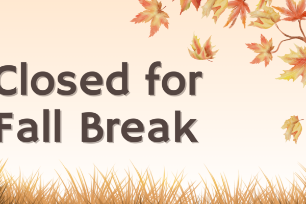 Text reading "Closed for Fall Break" is displayed against a background with autumn leaves, a tree, and grass.