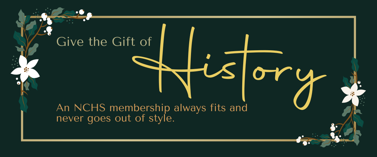 A dark green background with floral borders features the text "Give the Gift of History." Below, it reads "An NCHS membership always fits and never goes out of style." The design includes decorative white flowers and green leaves.